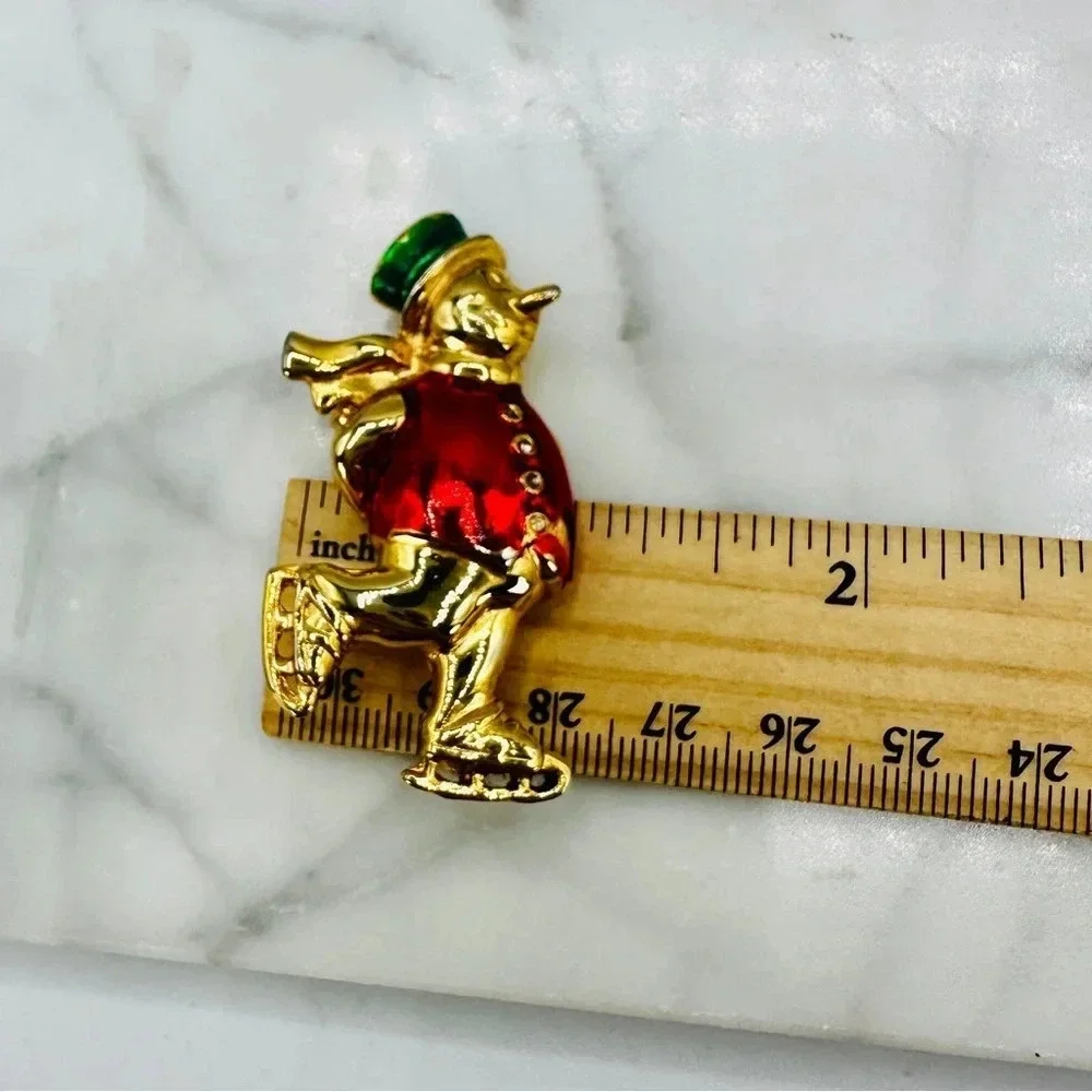 Vintage Christmas Snowman Ice Skating Brooch Pin Red Jacket Green Hat Go…